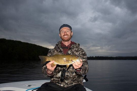 Fisherman portrait  proud  bass  fish Lake New Hampshire 
