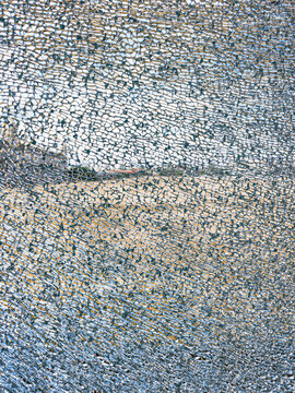 Detailed image of a broken and cracked tempered glass window.