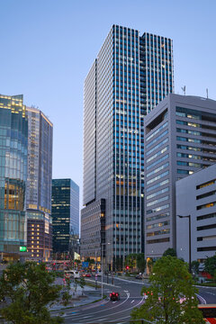 Tall Buildings Stand in the City of Osaka During Evening Time