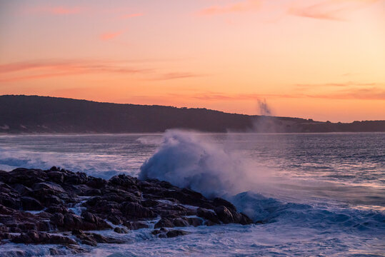 Wave breaking at sunset