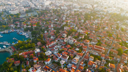 Fototapeta premium Antalya, Turkey. Aerial drone view of historic Kaleici Old Town with yacht marina and Mediterranean Sea connection in morning sun.. Aerial View
