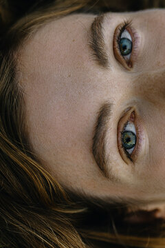 Woman's Close up Portrait with green-blue eyes with heterochromia