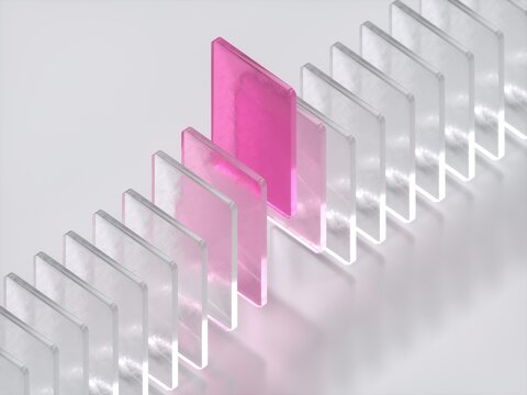Pink Frosted Glass Card Standing Out in a Row of Clear Plates