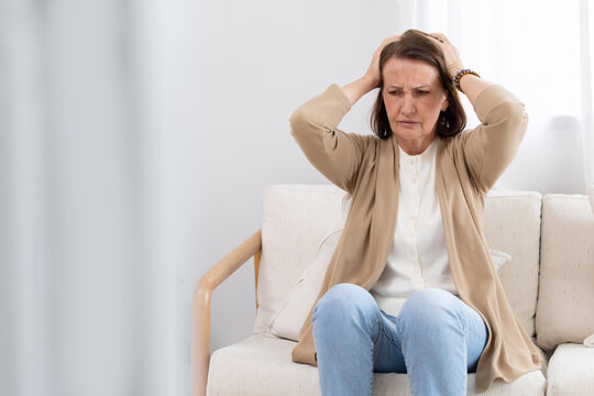 Senior woman grabher hair suffer frim stress