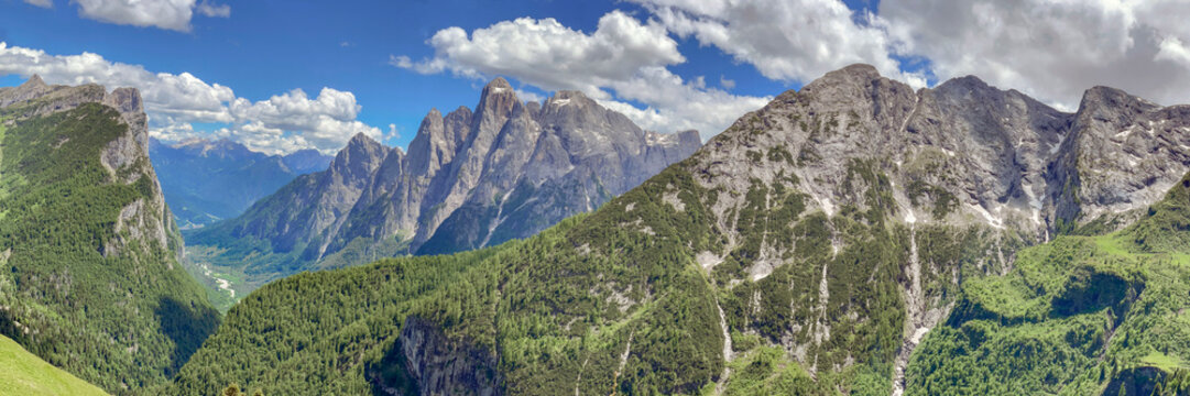 hiking in beautiful rocky peak mountains  in italian Dolomitesin summer