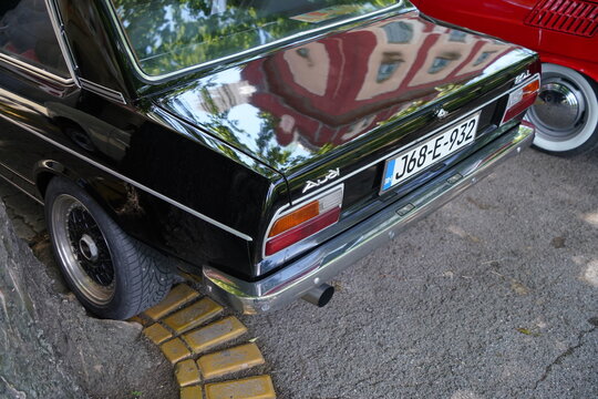 High angle close-up detailed view of back black oldtimer Audi 80 B1 (Typ 80) showing taillights and nameplates. Subotica, Serbia, on June 7, 2026