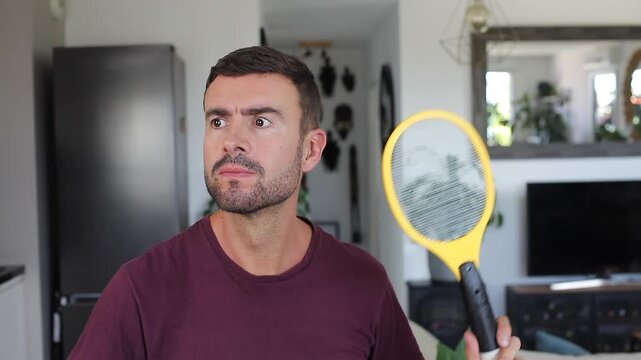 Man hunting insects with an electric tool 