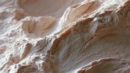 Obraz premium Close-up of a textured surface. the surface appears to be made of a light-colored material, possibly clay or plaster.