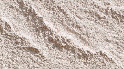 Naklejka premium Close-up of a textured surface. the surface appears to be made of a light-colored material, possibly sand or gravel. the texture is rough and uneven, with deep grooves and crevices running through it.