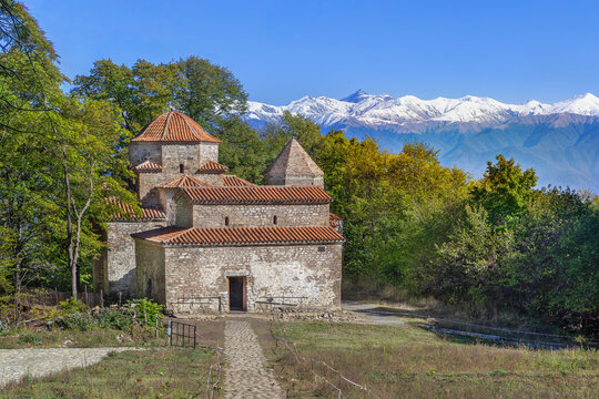 Dzveli Shuamta architectural ensemble stands in a green forest, Georgia. Front view of ancient churches in daylight