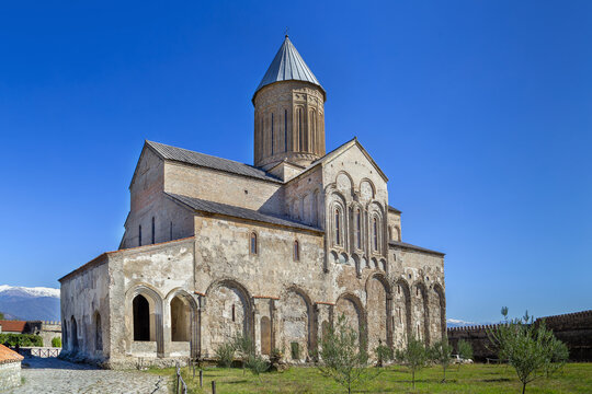 Majestic Alaverdi Monastery cathedral stands in Kakheti region, Georgia. Side perspective view in bright sunny daylight