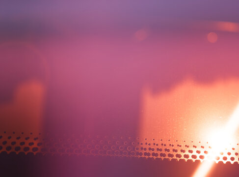 Dramatic light leak on the bus glass abstract backdrop