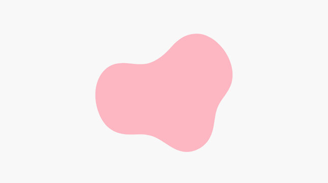 A pink blob is sitting on a flat surface indoors.
