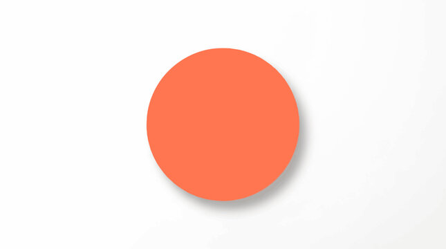 A large orange circle sits on a white surface with shadow.