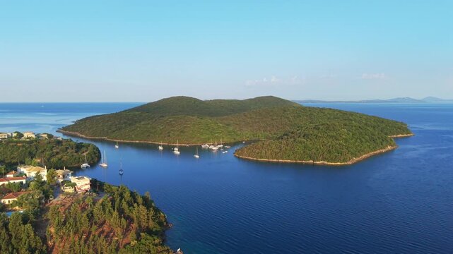 Aerial view of Yachts anchored at Saint Nicholas Island in Syvota scenic islet off the coast of mainland Greece
