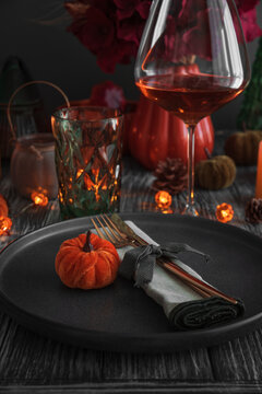 Autumnal table setting preparing for Thanksgiving dinner