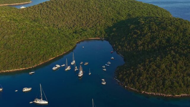 Aerial view of Yachts anchored at Saint Nicholas Island in Syvota scenic islet off the coast of mainland Greece