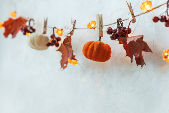 Autumn felt pumpkins garland with fall leaves berries