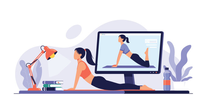 Fit woman following an online yoga class on a computer monitor at home while practicing a cobra pose on her mat in the living room.