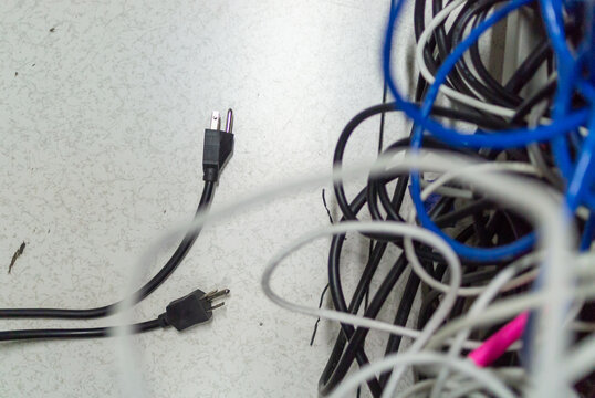 tangled network cables with unplugged power cord