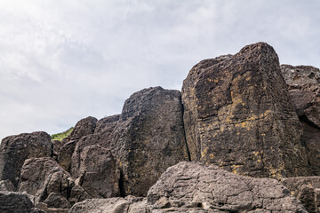 Fototapeta premium Columnar Joints at Tawaraiso Beach. Igneous rocks (Andesite & Basaltic Andesite Lava). Cape Tsumeki, Shimoda city, Izu Peninsula,Shizuoka Prefecture, Japan. Philippine Sea Plate, Andesite Basalt