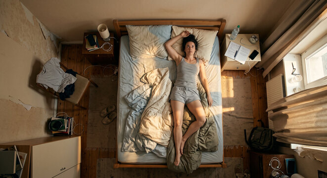 Overhead View Of Non Restorative Sleep During Summer Heat