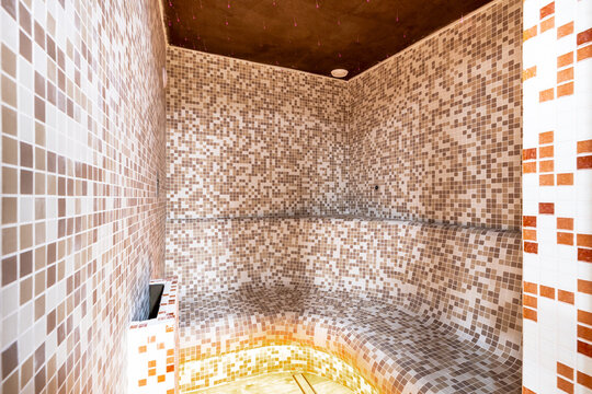 Modern steam room interior with mosaic tiles for wellness
