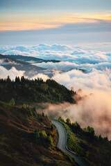 Obraz premium Aerial view road in Caucasus mountains and clouds in Georgia, travel beautiful destinations explore Guria nature summer season Gomis Mta sunset scenery
