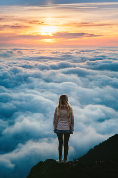 Woman hiker standing alone above clouds on cliff edge travel in Georgia hiking mountains solo active adventure summer vacations Gomis Mta tour outdoor, tourist enjoying sunset view harmony with nature