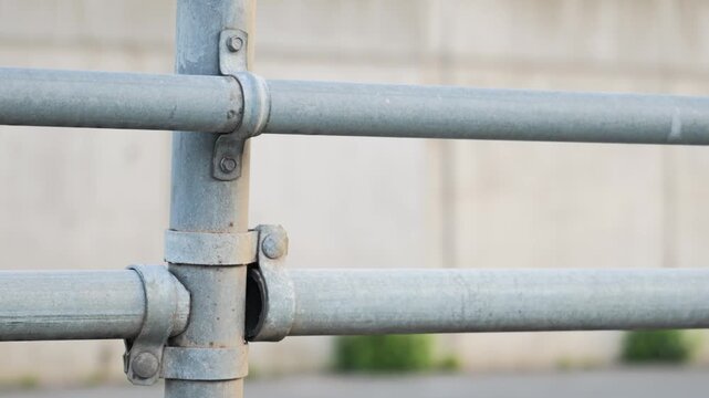 Close up of galvanized steel safety handrail pipe joint