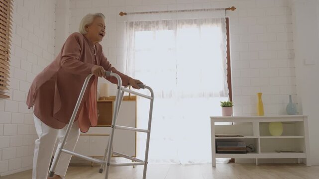 Health insurance with caregiver at home caregiver senior fall home emergency help injury accident healthcare indoor elderly woman walker mobility support recovery living room care aid independence