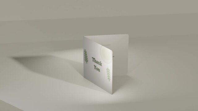 Opening card turning on table under spotlight, casting left shadow, revealing message and Thank You