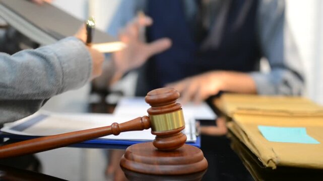 Close up of businessmen or lawyers discussing contract or business agreement at law firm office, Business people making deal document legal, justice advice service concept.