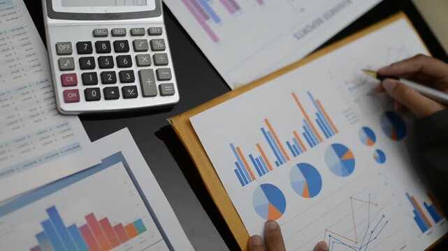 Accountants processing financial documents and taxes, managing corporate finance in a modern office. Audit and taxes in business