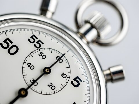 Close-up of vintage analog stopwatch with second hand ticking for timing and precision measurement