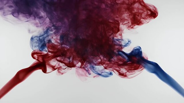 Abstract Red and Blue Smoke Swirls Facing Each Other