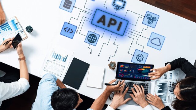 Collaborative Workspace with People Analyzing Data and Developing API Solutions in a Modern Office Environment. Entropy.