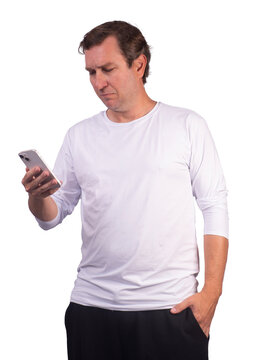 Male model wearing glasses and a white long-sleeve UV 50+ polyamide sports shirt, looking at his phone.