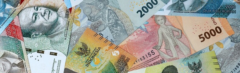 Indonesian rupiah money bills in pile on table. Indonesia IDR currency cash close up © Viktor