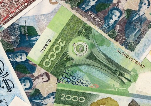 Algerian dinar money bills in pile on table. Algeria DZD currency cash close up
