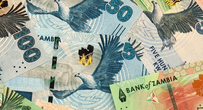 Zambian kwacha money bills in pile on table. Zambia ZMW currency cash close up