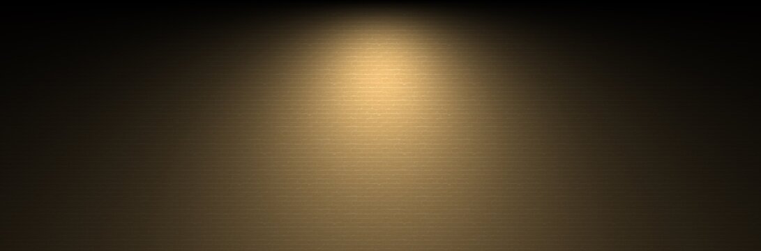 Wide warm mustard brick wall background with golden spotlight beam and rustic tan masonry block facade