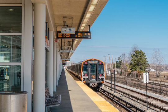 Boston, Massachusetts, USA -March 21, 2023 : Orange Line train stopped at Assembly Square Station is a rapid transit station in Somerville, Massachusetts. It serves the MBTA public transit system.