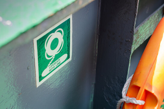Life buoy with line safety sign indicating the location of a lifebuoy on board. Safety signage enables crew members to quickly locate life-saving equipment during emergency situation