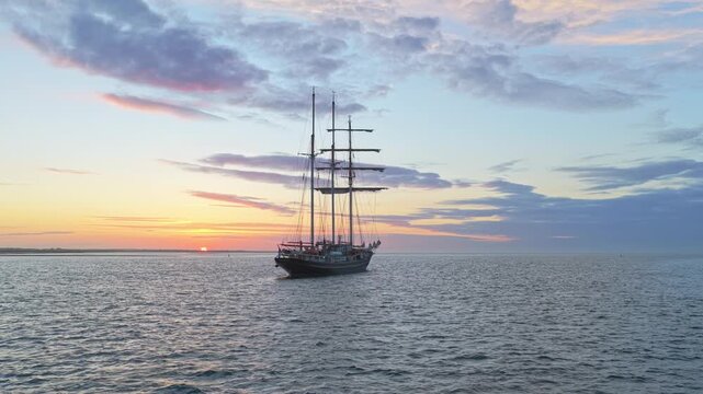 Tall ship gulden leeuw sailing on the sea at sunset