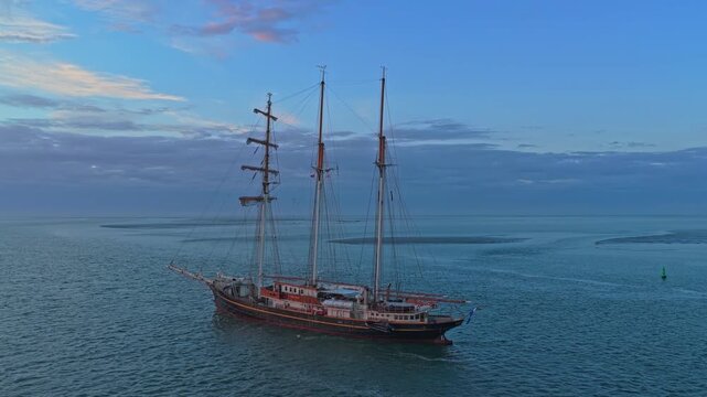 Three masted gulden leeuw tall ship sailing on the wadden sea