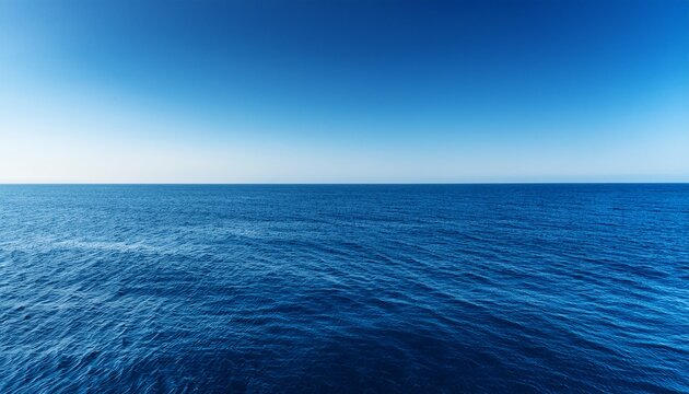 vast blue ocean and a cloudless sky with room for text