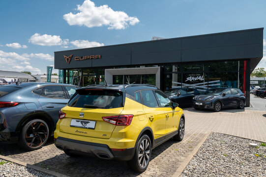 Wolfsburg, Germany - 15 July 2026: Exterior shot of a modern Cupra and Seat car dealership under a blue sky in Wolfsburg