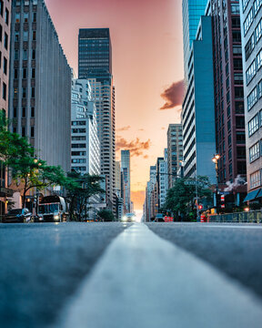 Low Angle View of Midtown Manhattan Street at Colorful Sunset