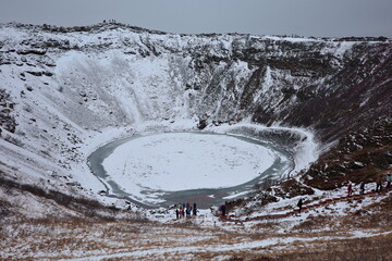 Kerid Crater Lake Frozen in a Snowy Icelandic Winter © fujitoey